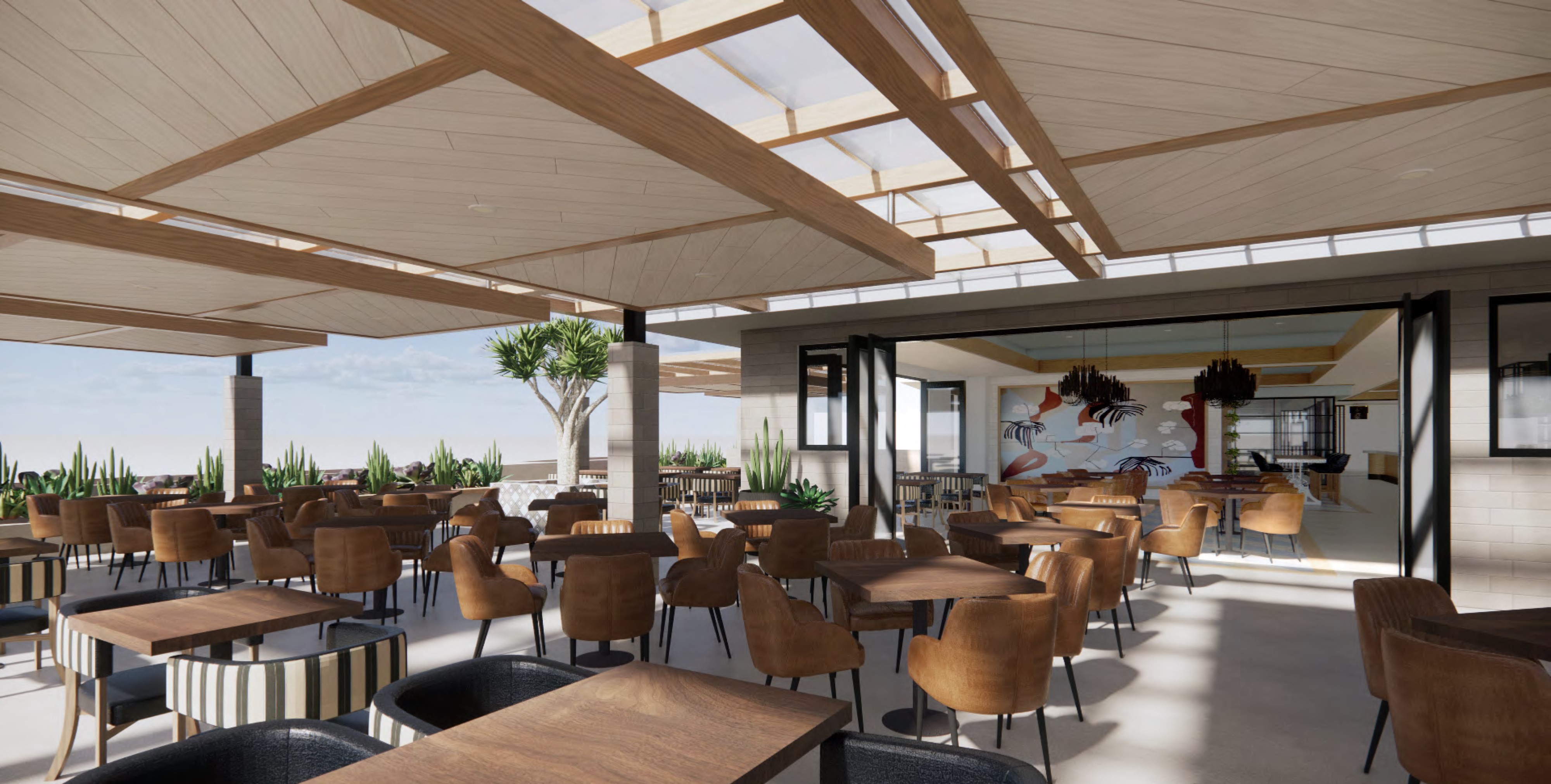 Modern restaurant interior with wooden tables and chairs, large skylights, green plants, and an open layout leading to an adjacent room with bar seating and open-air patio.